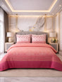 Pink bedspread and pillows on a bed in a stylish bedroom with marble wall and lamps.