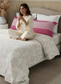 Boutique Living comforter category showcasing elegant pink-and-white printed comforters for modern bedrooms.